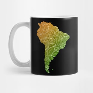 Colorful mandala art map of South America with text in green and orange Mug